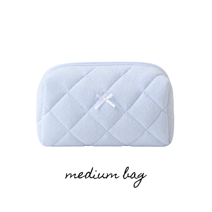 MEDIUM QUILTED MAKEUP BAG - SOMETHING POINTELLE