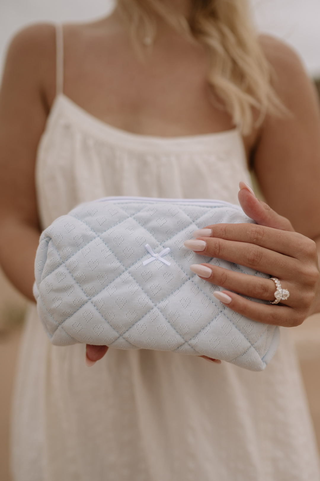 MEDIUM QUILTED MAKEUP BAG - SOMETHING POINTELLE